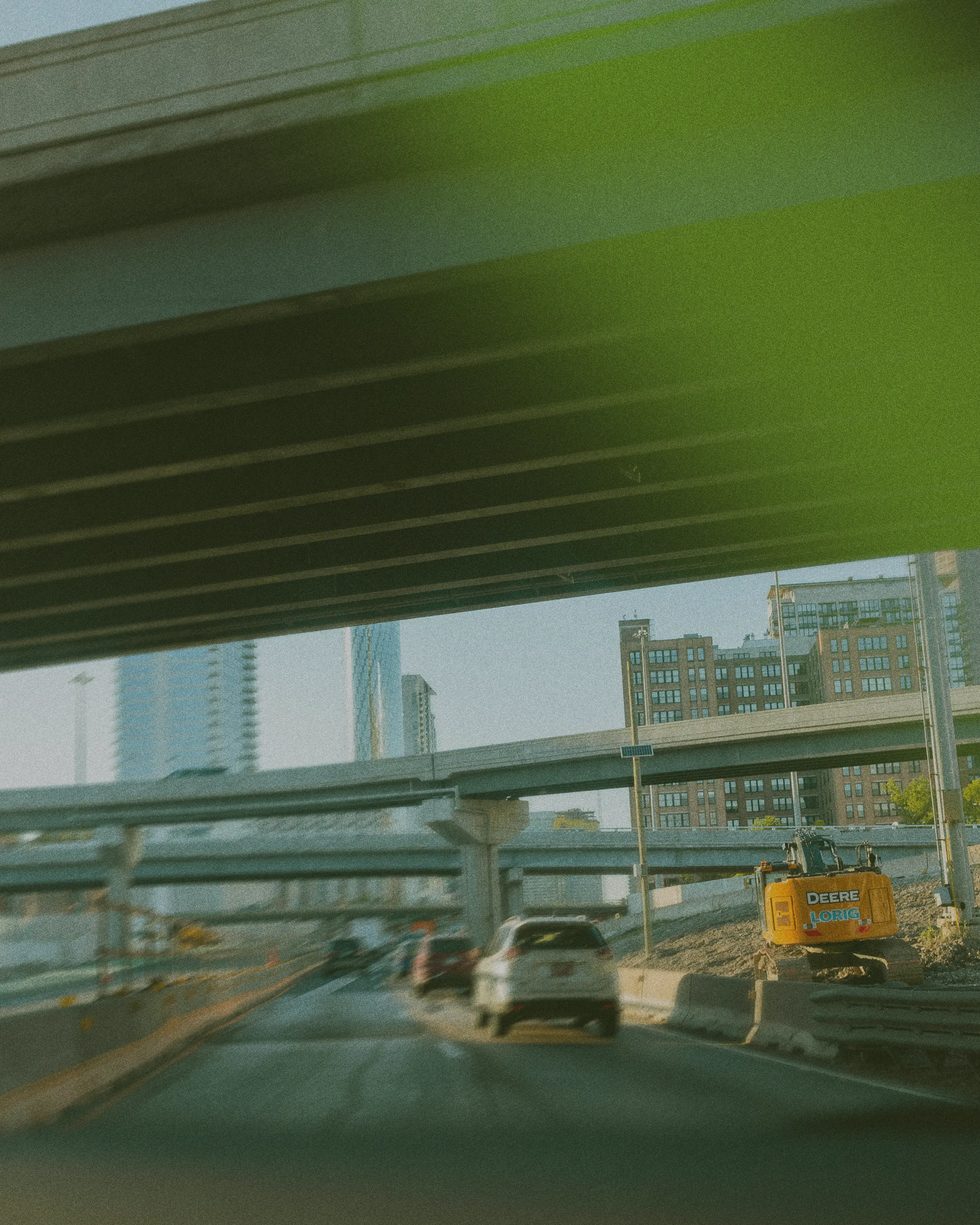 Cars driving through underpass in city