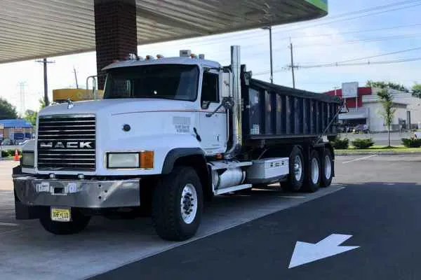 roll-off truck refilling at the gas station