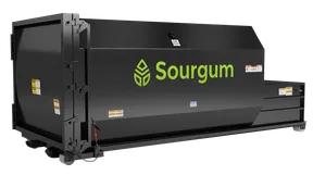 A black Sourgum 30 yard self contained roll off waste and recycling compactor