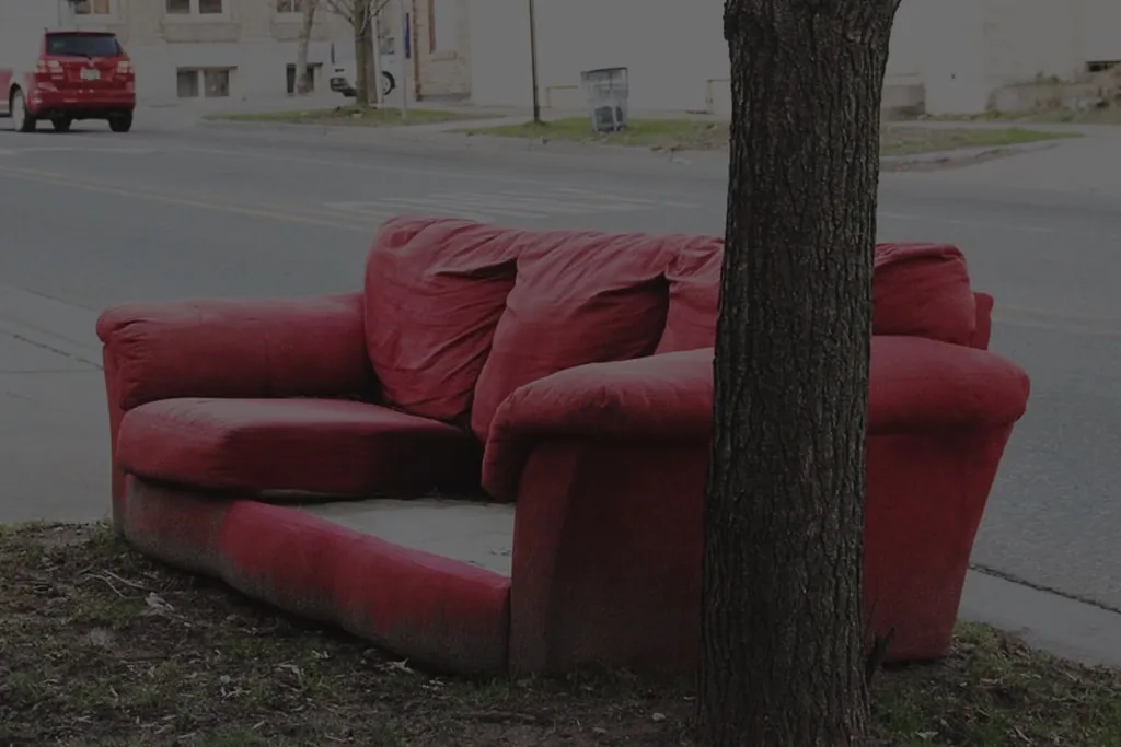 image of a couch on the sidewalk