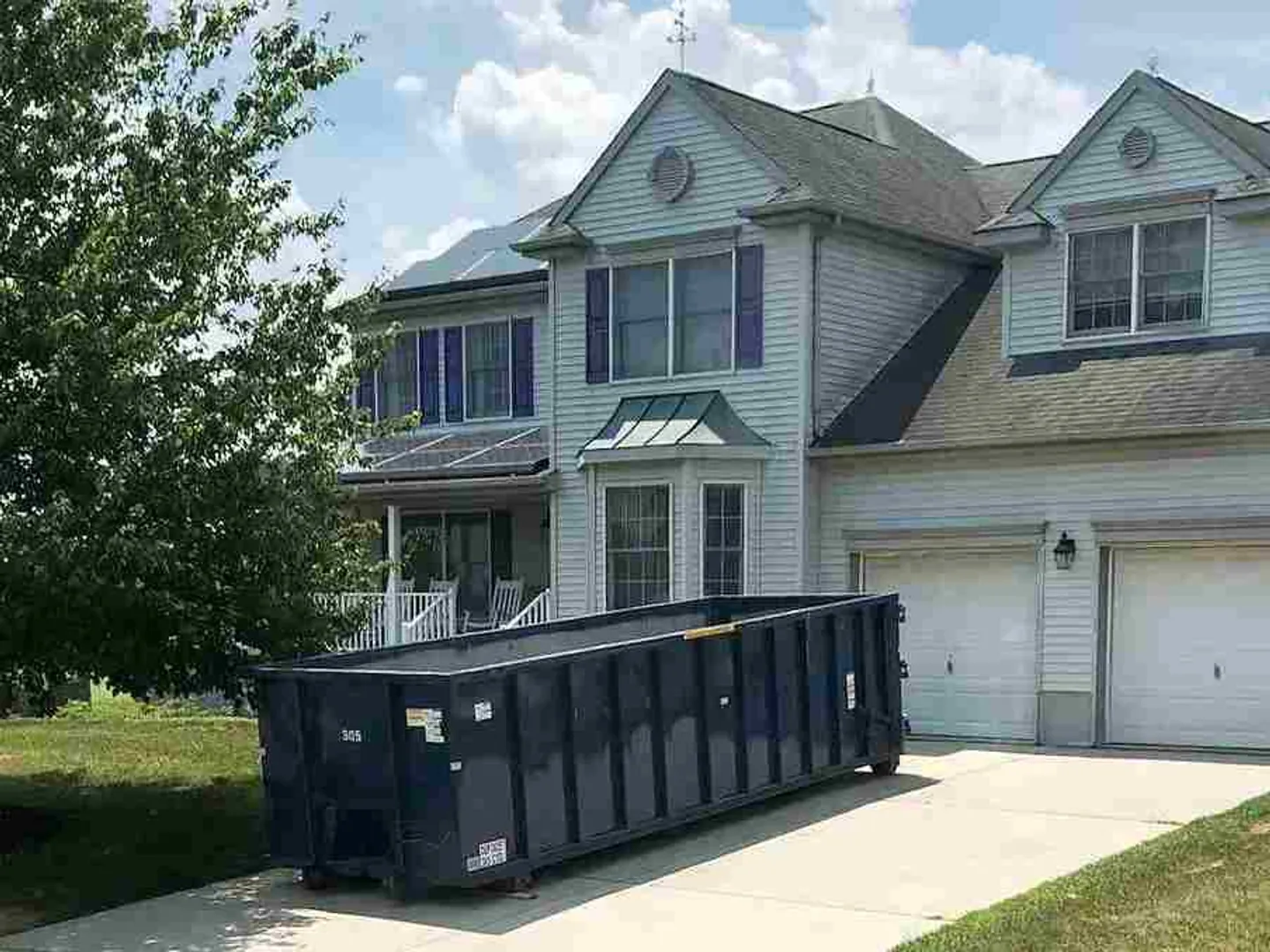 Roll off dumpster in driveway