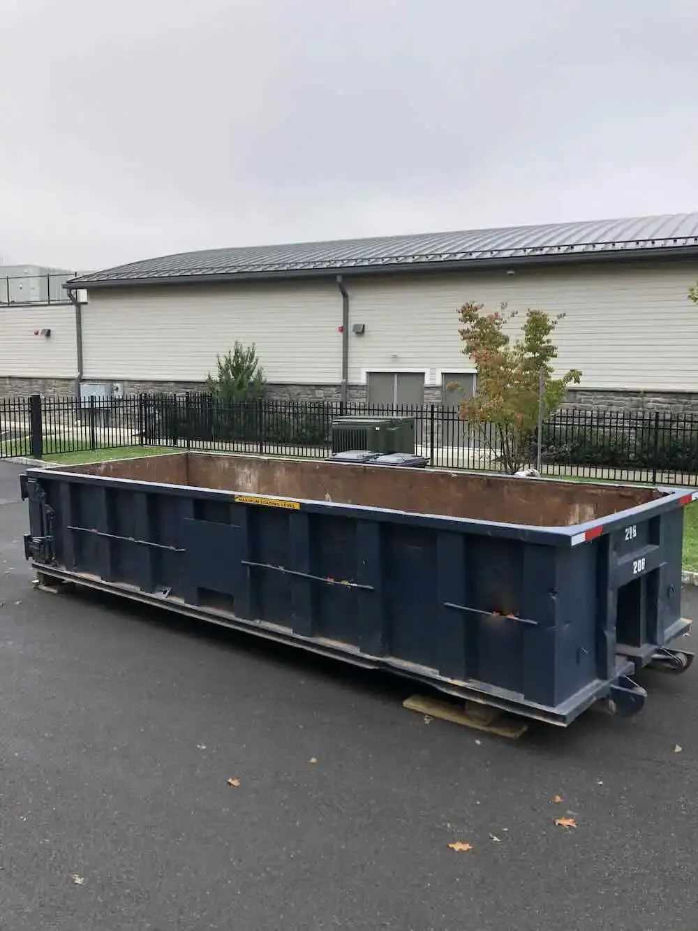 dumpster inside gate