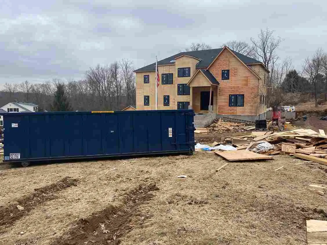 Image of a dumpster on a job site