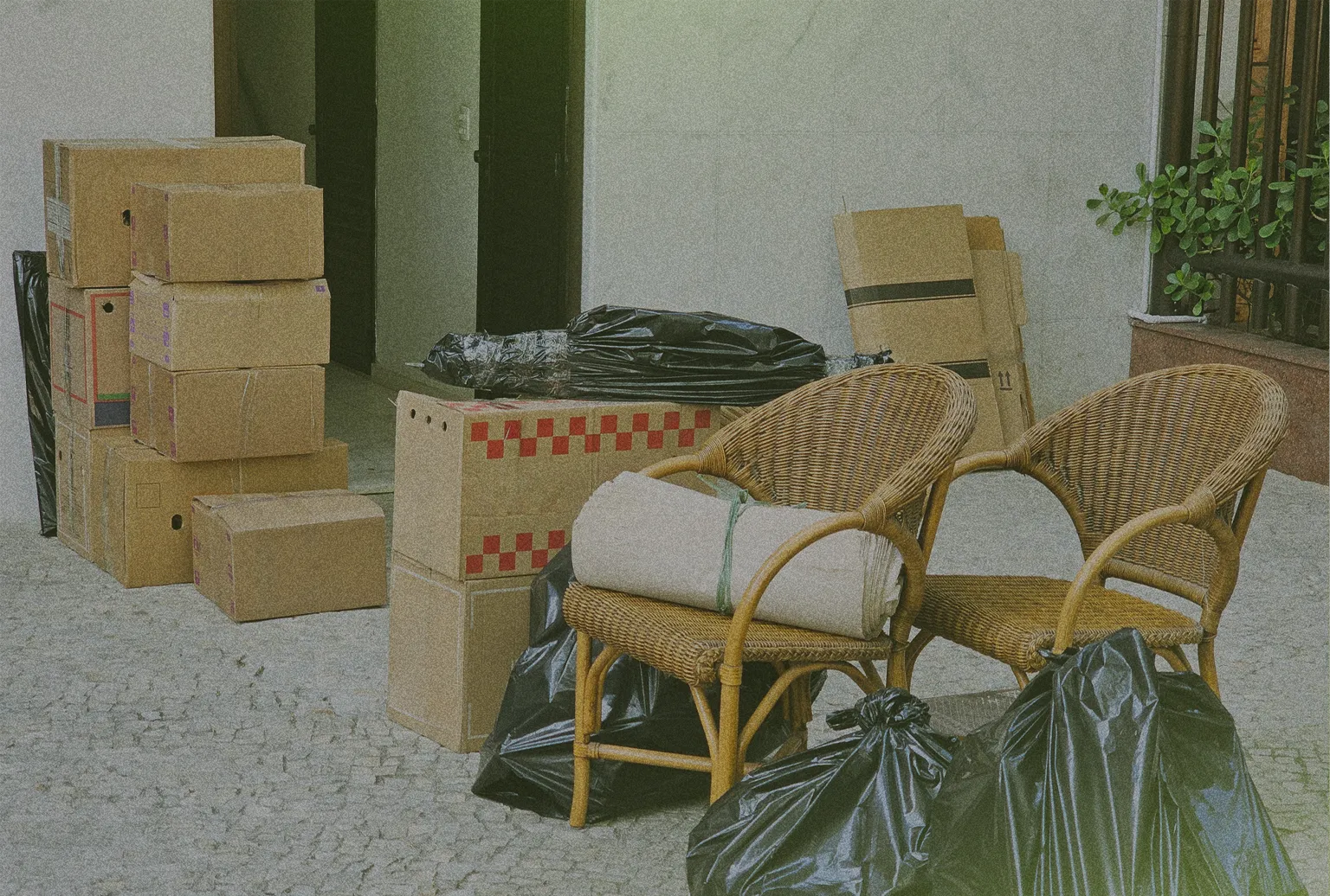 moving boxes and household trash outside