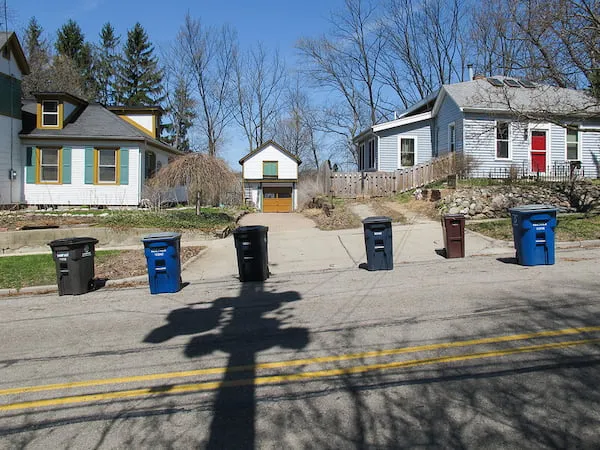 Residential garbage toters lined up on the street