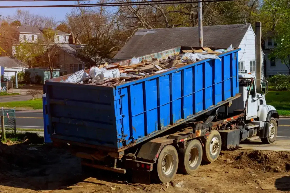 Blue dumpster on truck