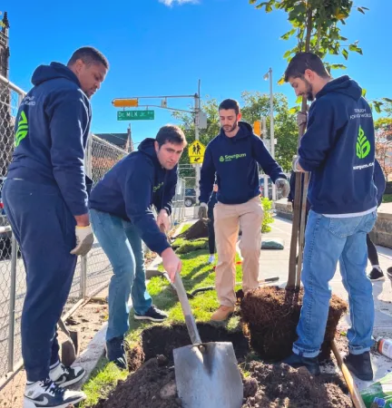 Sourgum team planting trees